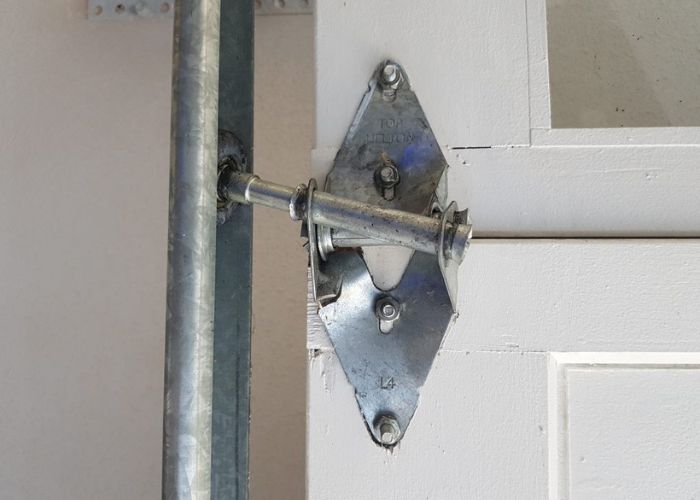 What Causes Garage Door Hinges to Bend Repeatedly
