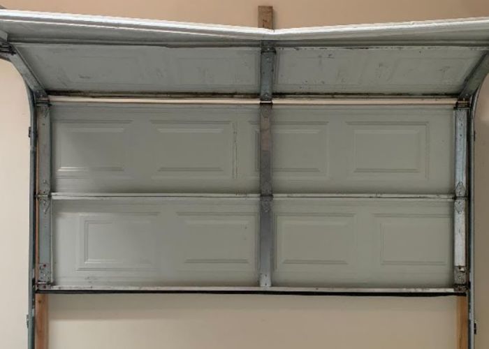 Why Does My Garage Door Panel Sag on One Side